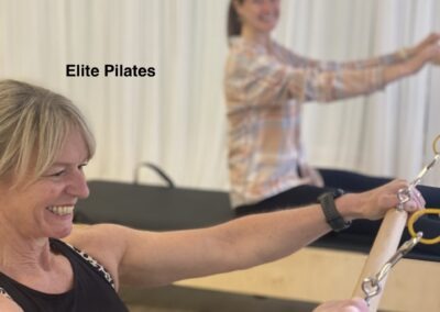 Pilates reformer teacher training instructor on the reformer machine