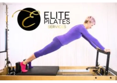 Reformer instructor on the reformer with caption Elite Pilates Services Newton Abbot